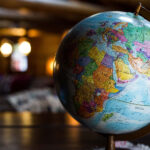 World globe on a wooden table, symbolizing global travel destinations