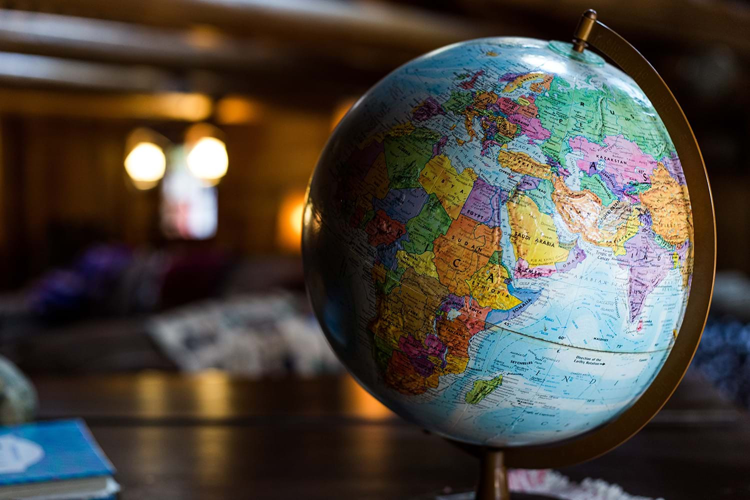 World globe on a wooden table, symbolizing global travel destinations