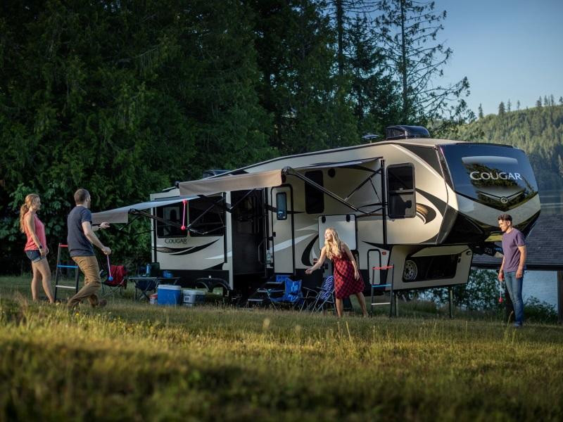 Exterior view of a pre-owned travel trailer showcasing its bumper pull hitch and compact design, ideal for first-time RV buyers.