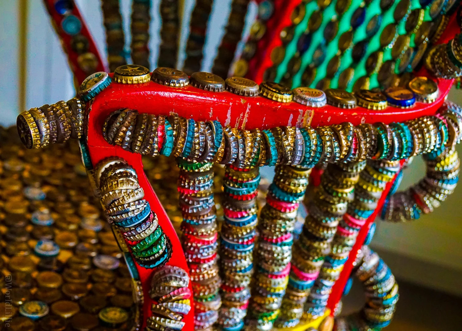 Bottle cap chair symbolizing travel and mixed linguistic contexts