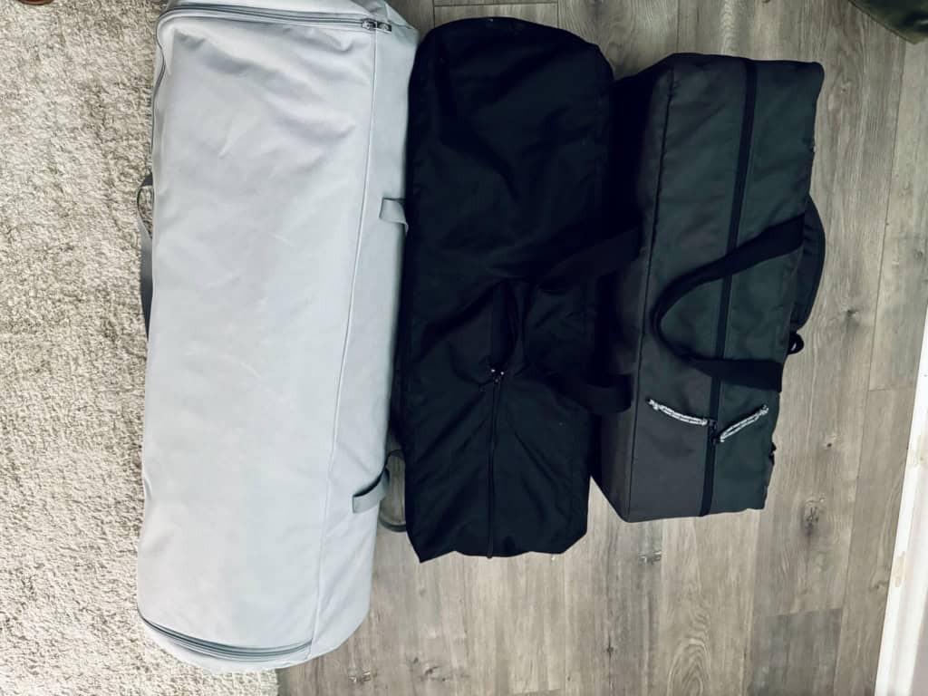Side-by-side comparison of Newton Travel Crib, Graco Pack 'n Play, and Guava Family Lotus, showcasing the Newton's potentially larger size and different design.