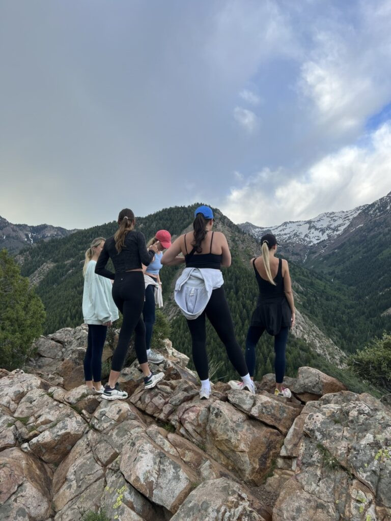 People enjoying outdoor activities in a park setting, representing the active lifestyle and recreational opportunities in Utah.