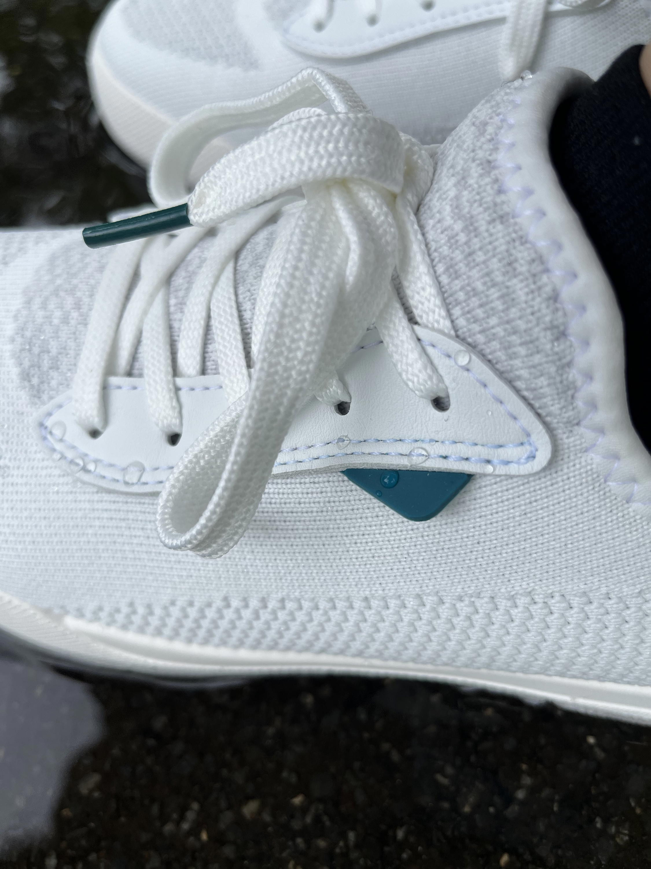 Side view of Vessi Weekend sneakers with water beading on the shoe.
