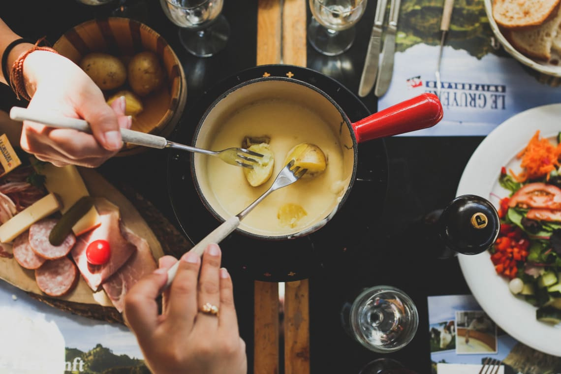 Indulge in the rich and flavorful experience of traditional Swiss cheese fondue.