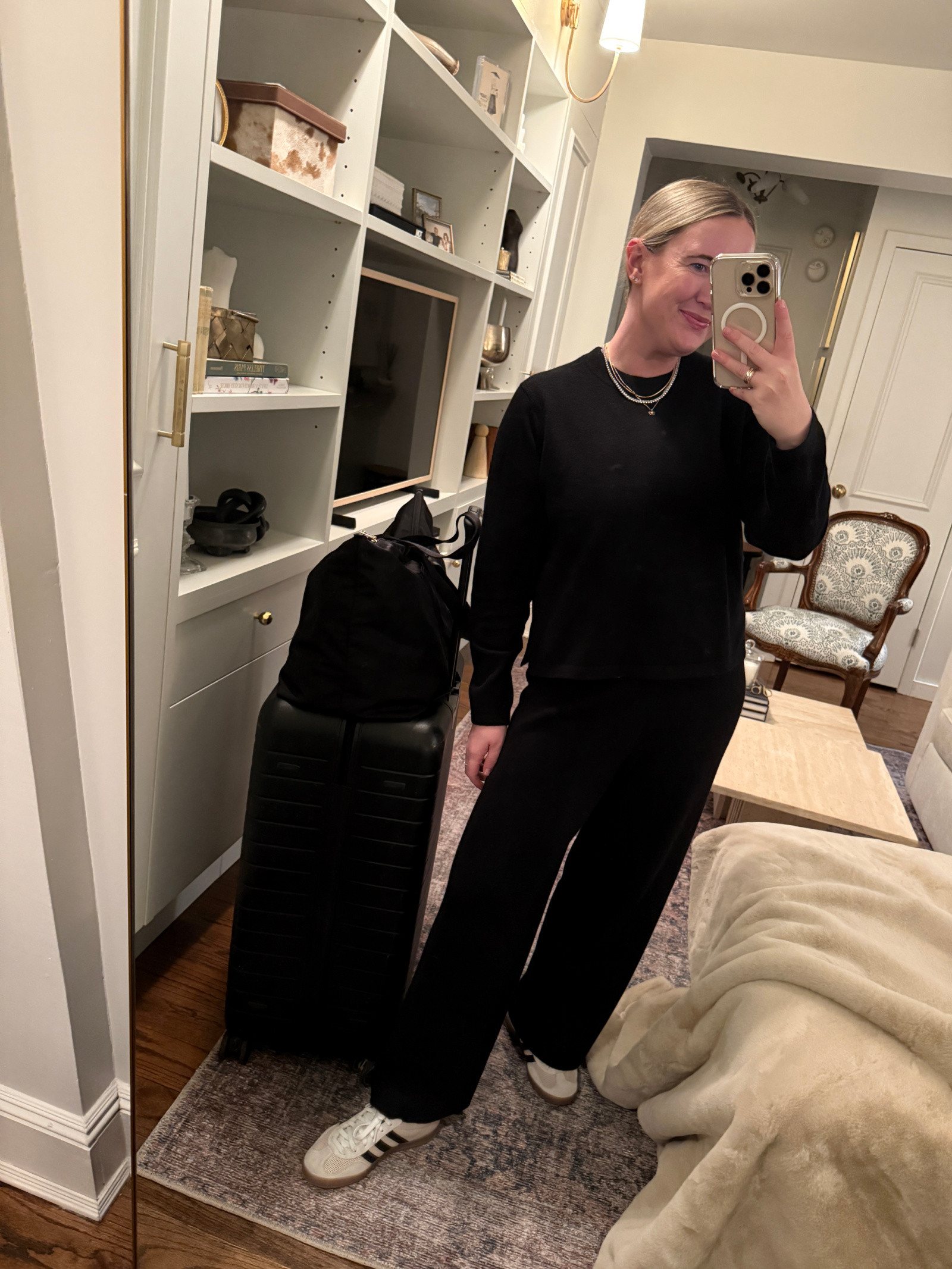 Travel attire idea featuring a Kilte knit set in a neutral color, demonstrating a chic and cozy option for colder flights.