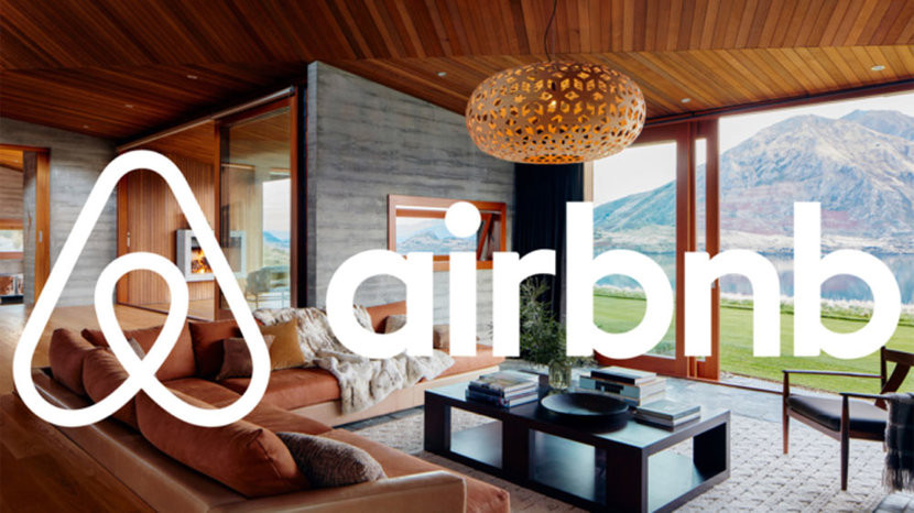 Person using Airbnb on a laptop to search for travel nurse housing