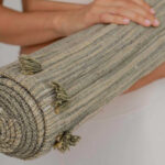 rolled up travel yoga rug