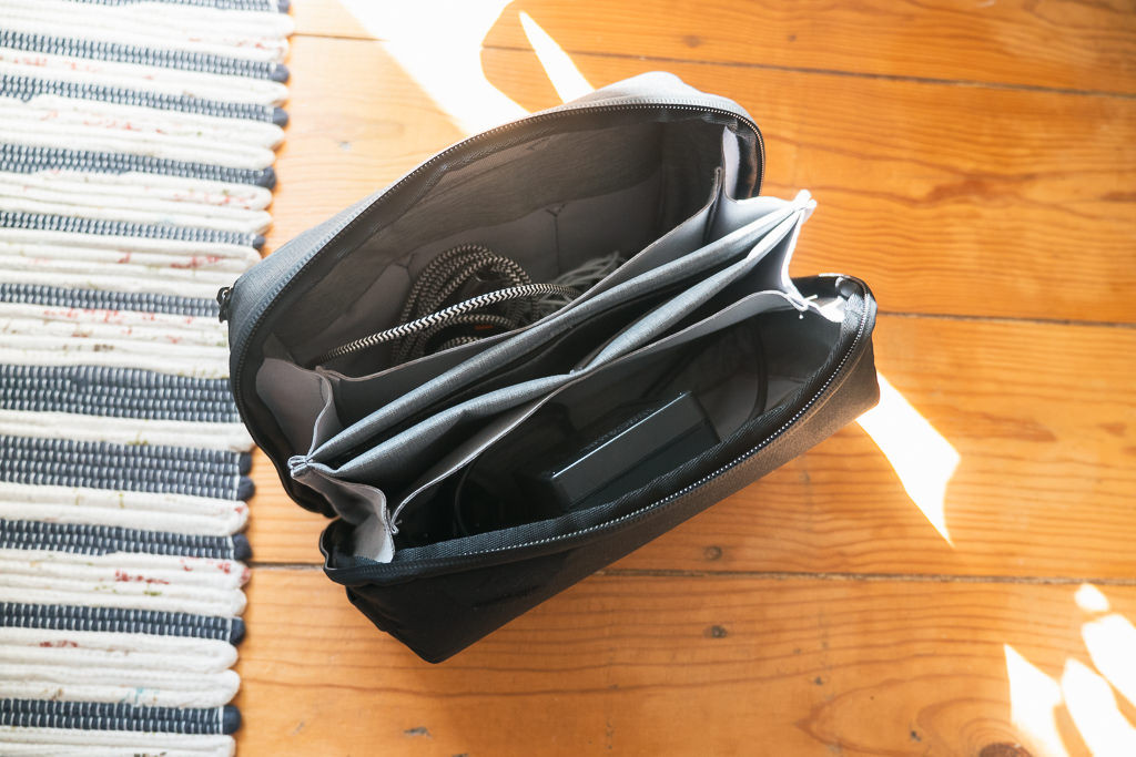 Collage showcasing Peak Design accessories including the electronics pouch, packing cube, and wash pouch, highlighting the modular system and organizational benefits.