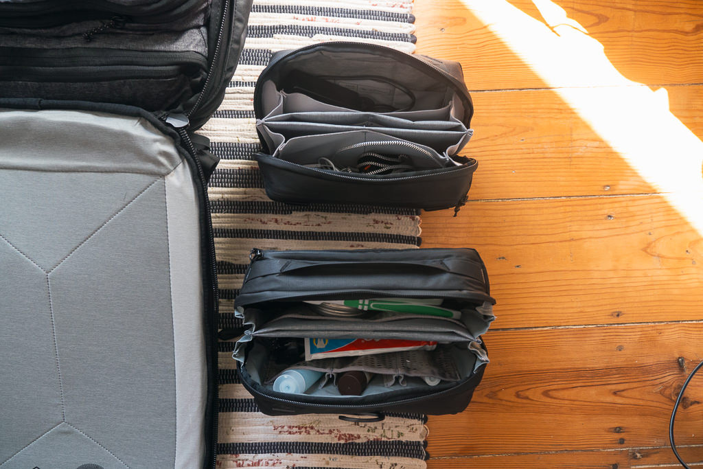 Side view of the Peak Design 45L Travel Backpack, illustrating its depth and overall profile when packed, providing a sense of its size and shape.