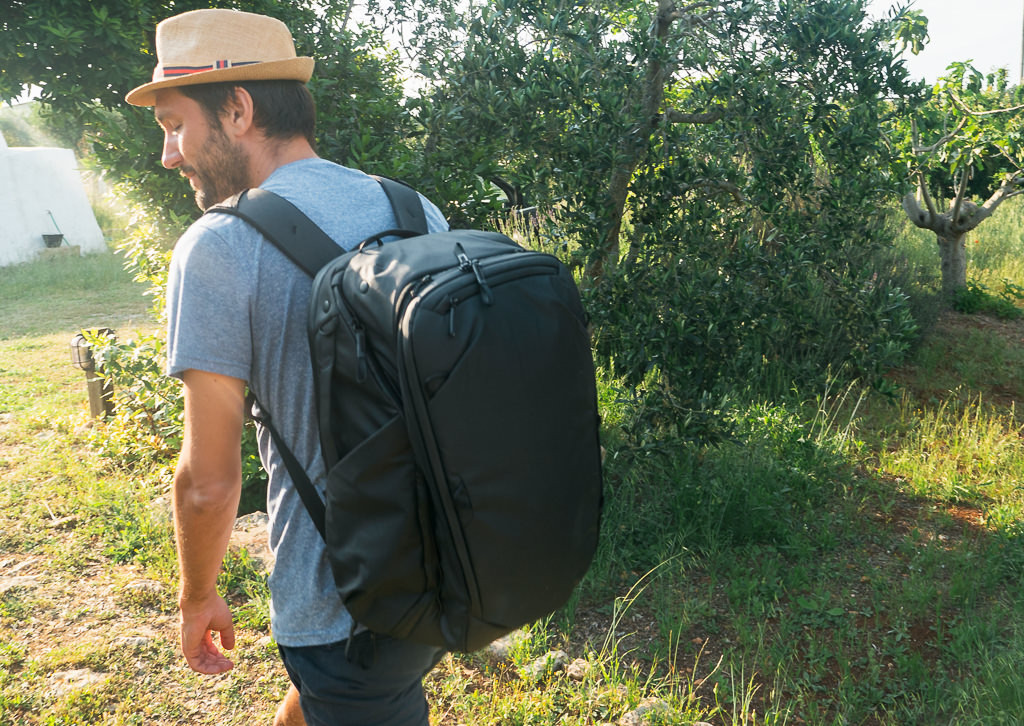 Close-up of the Peak Design 45L Travel Backpack showcasing its laptop sleeve, outer straps, and top pocket, emphasizing its organizational features.