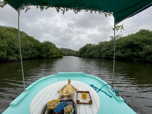 Guests enjoying boating near El Otro Lado hotel, Portobelo, Panama, showcasing Caribbean Sea activities