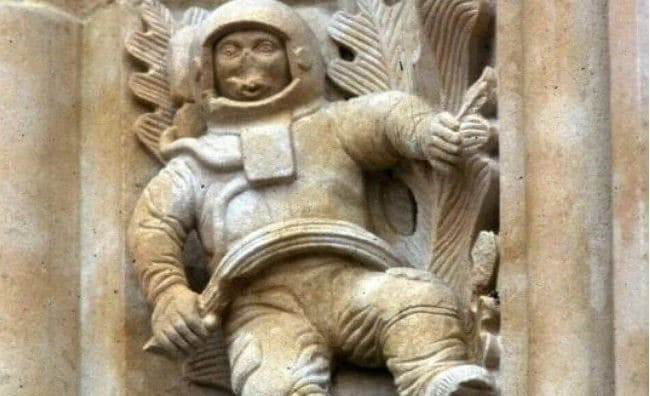 Sculpture on a church wall resembling an astronaut, proposed as ancient time travel evidence