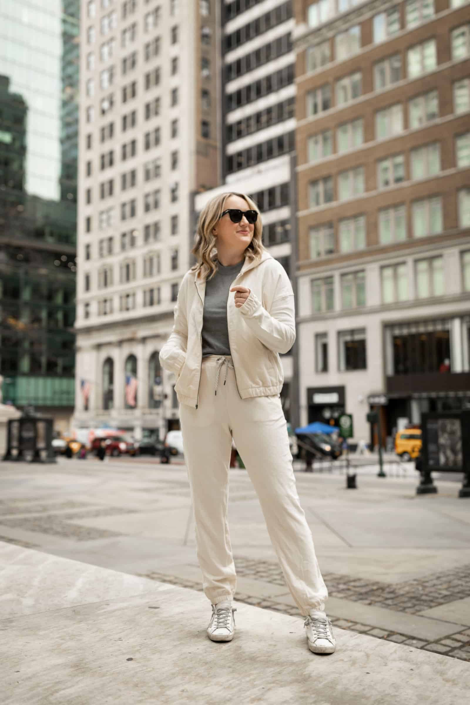 Woman in a matching Vuori lounge set, showcasing a coordinated and comfortable outfit perfect for stylish travel.
