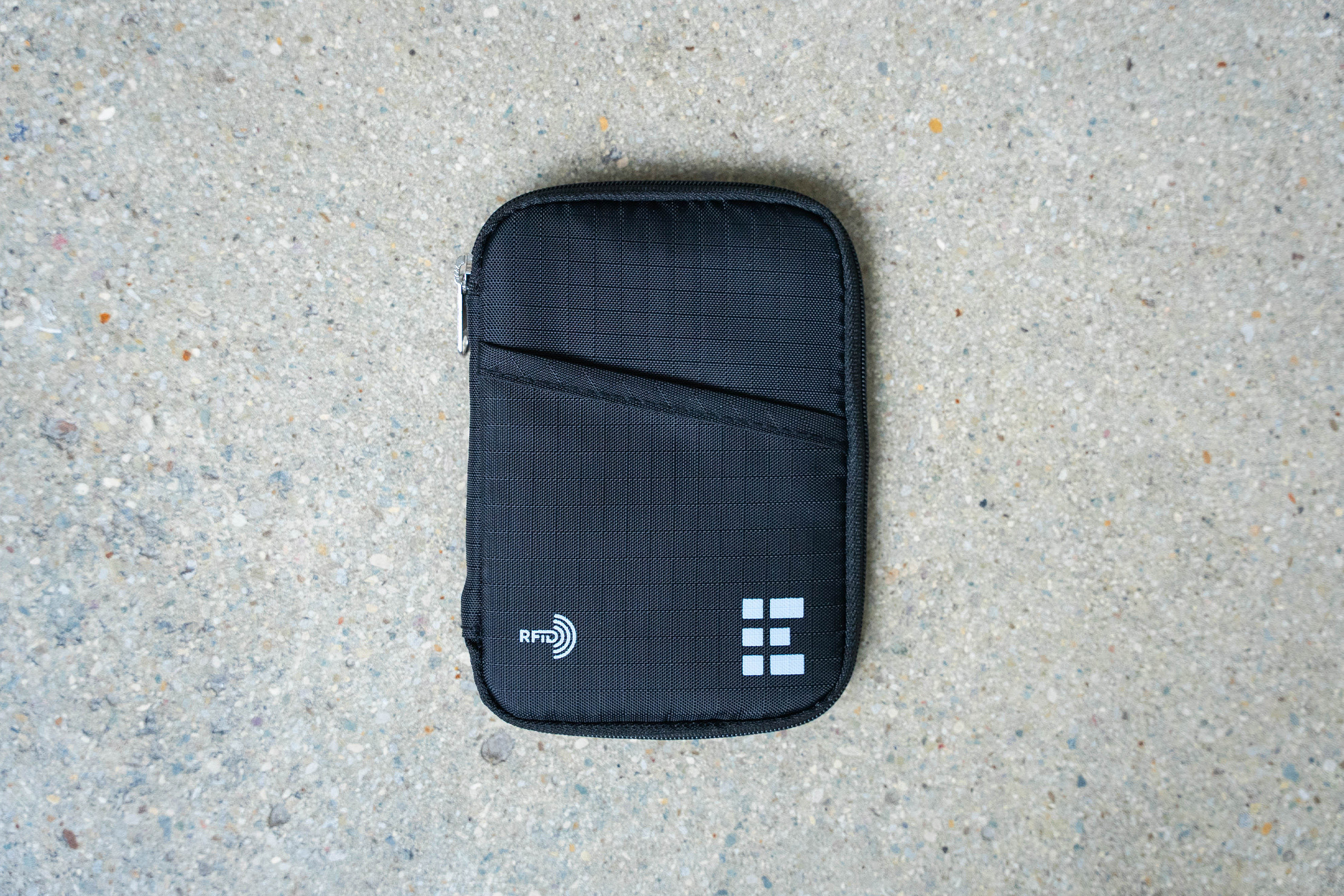 Zero Grid Passport Wallet Review for Men:  A solo shot emphasizing its compact size yet surprising storage capacity for male travelers.