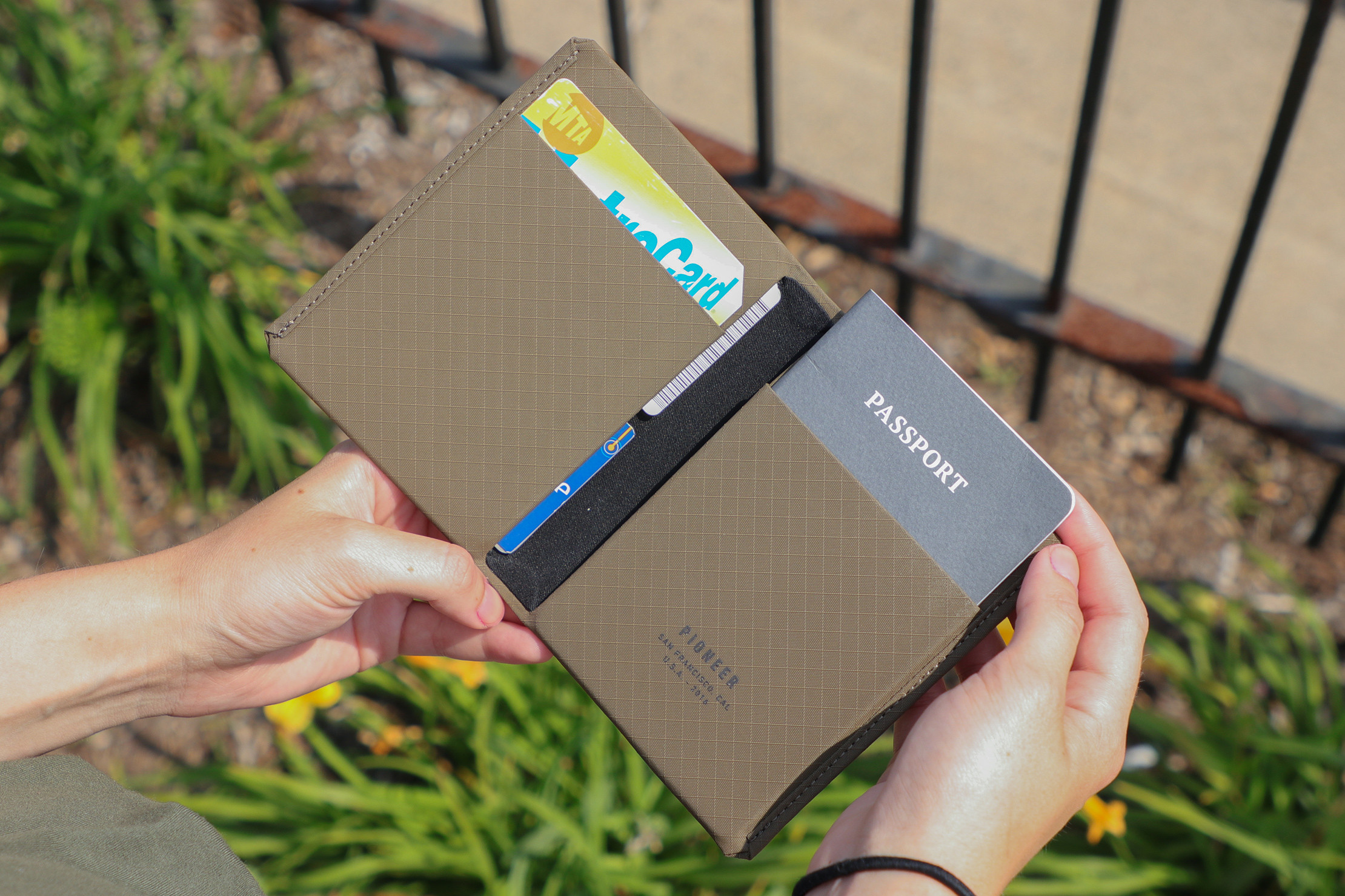 Pioneer Passport Wallet for Men: In use in Detroit, showcasing its practical design for the professional male traveler.