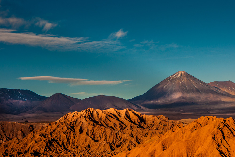 Red sands of the Atacama Desert in Chile, highlighting the unique desert landscape and vastness of the region