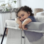 Baby sleeping safely in a travel pack and play