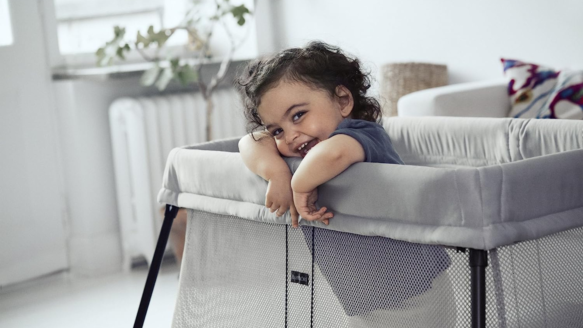 Baby sleeping safely in a travel pack and play