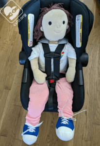 Britax Willow with 16-month-old doll, showing the car seat's capacity to accommodate an older infant nearing the maximum height limit.