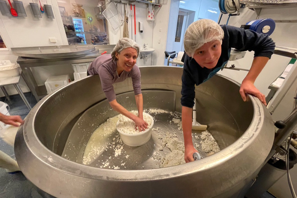 Brook and son Zeke packing cheese curds into rounds.