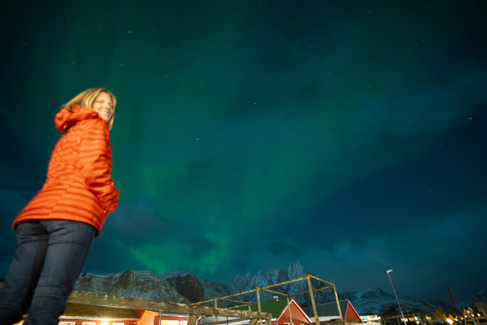 Brook with the northern lights in the background at the Hattvika Lodge.