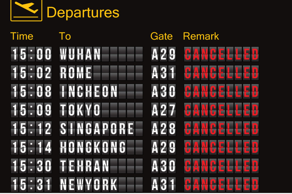 Airport departure board showing cancelled flights to various destinations