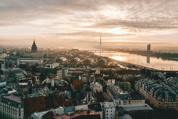 Enjoy Riga, Latvia, a cheap and family-friendly European city, showcasing its charming Old Town and colorful buildings.