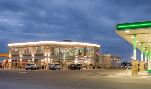 Coffee Cup Travel Plaza Exterior at Night