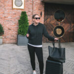 Woman wearing a cozy cashmere hoodie and joggers, a perfect example of comfortable separates for travel.