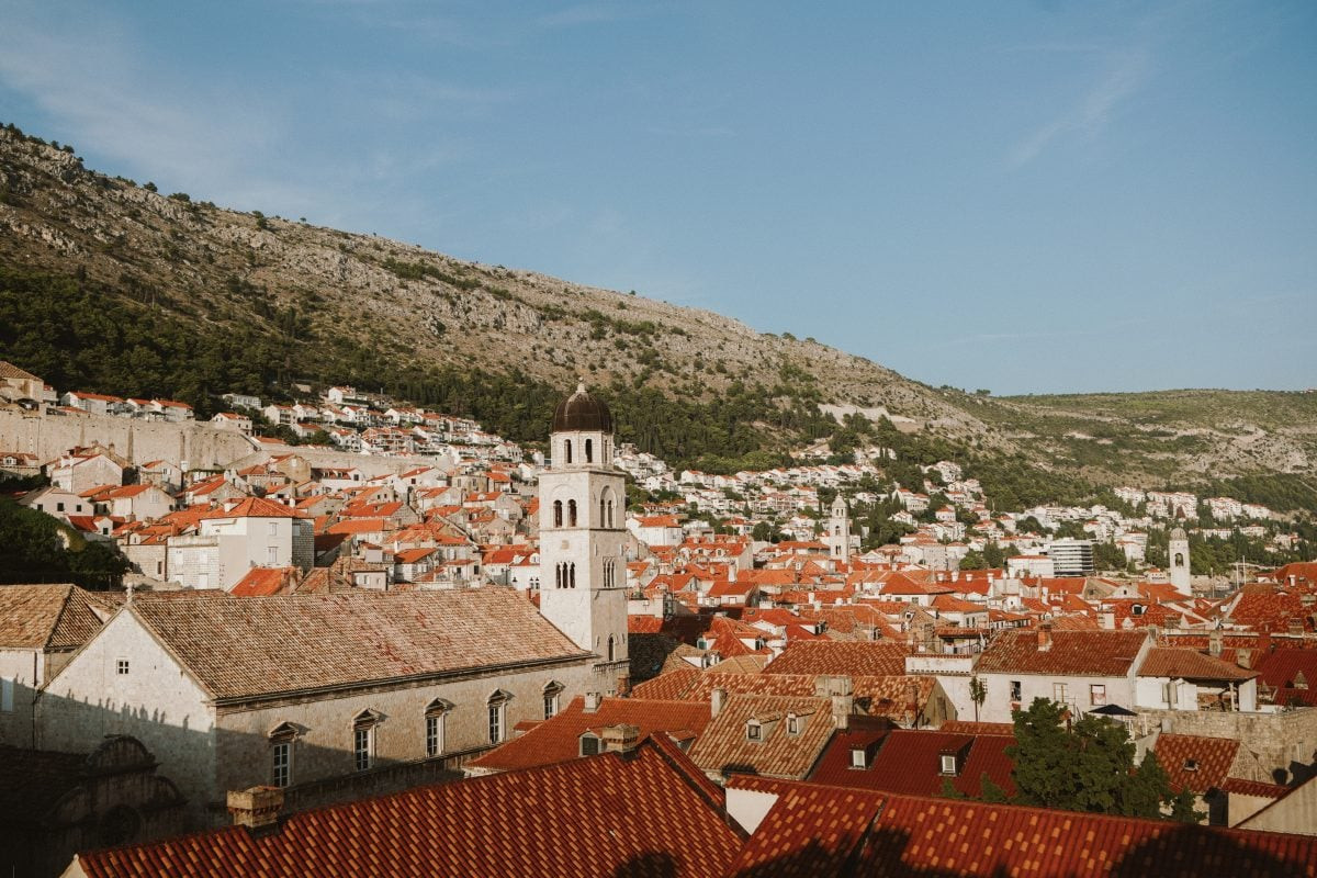 Breathtaking sunset over Dubrovnik city walls, a must-see experience on your Croatia travel itinerary.