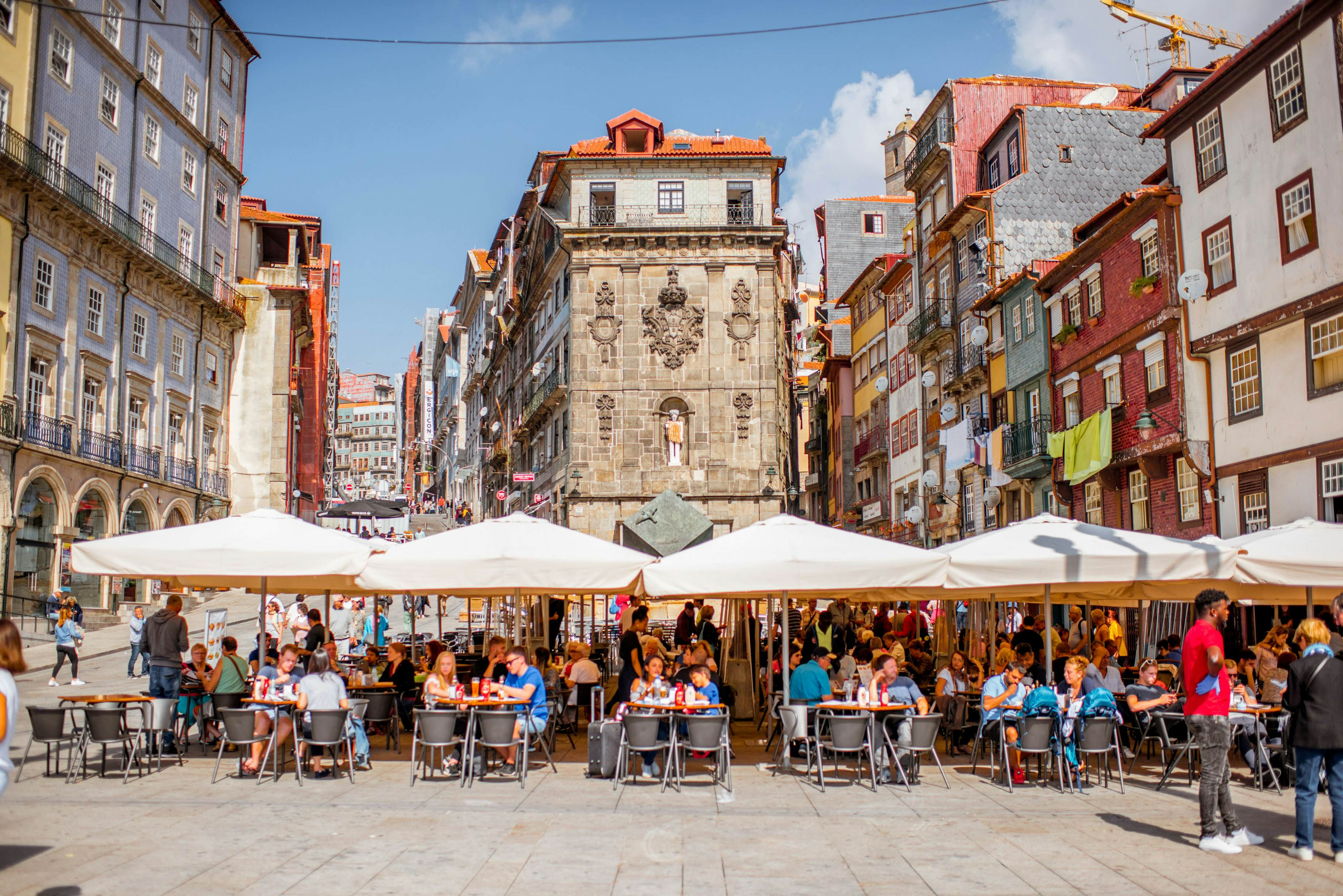 People enjoying cafes in Ribeira district, Porto, Portugal