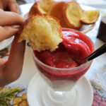 A vibrant display of granita flavors, including lemon and almond, served with brioche.