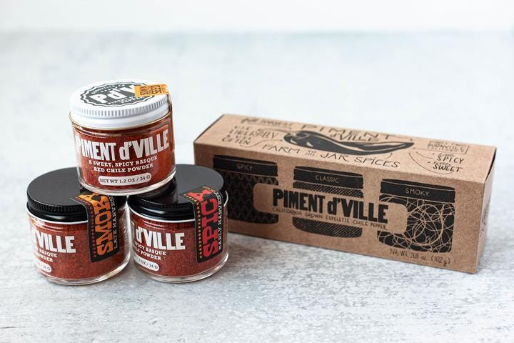 Piment d'Ville collection from Boonville Barn Collective, presenting a range of chile products in rustic packaging.