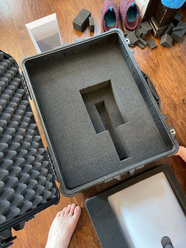 Customizing the Pelican case foam to create a secure compartment for the Starlink dish, including its fixed mounting pole.