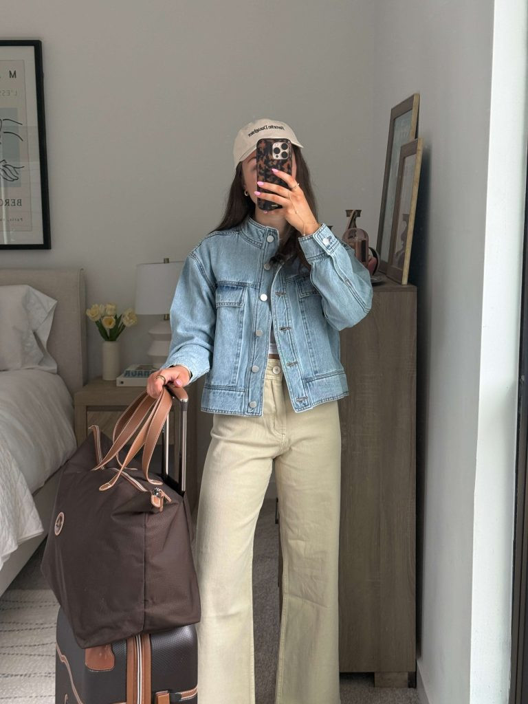 Woman efficiently packing suitcase using vacuum packing bags for travel