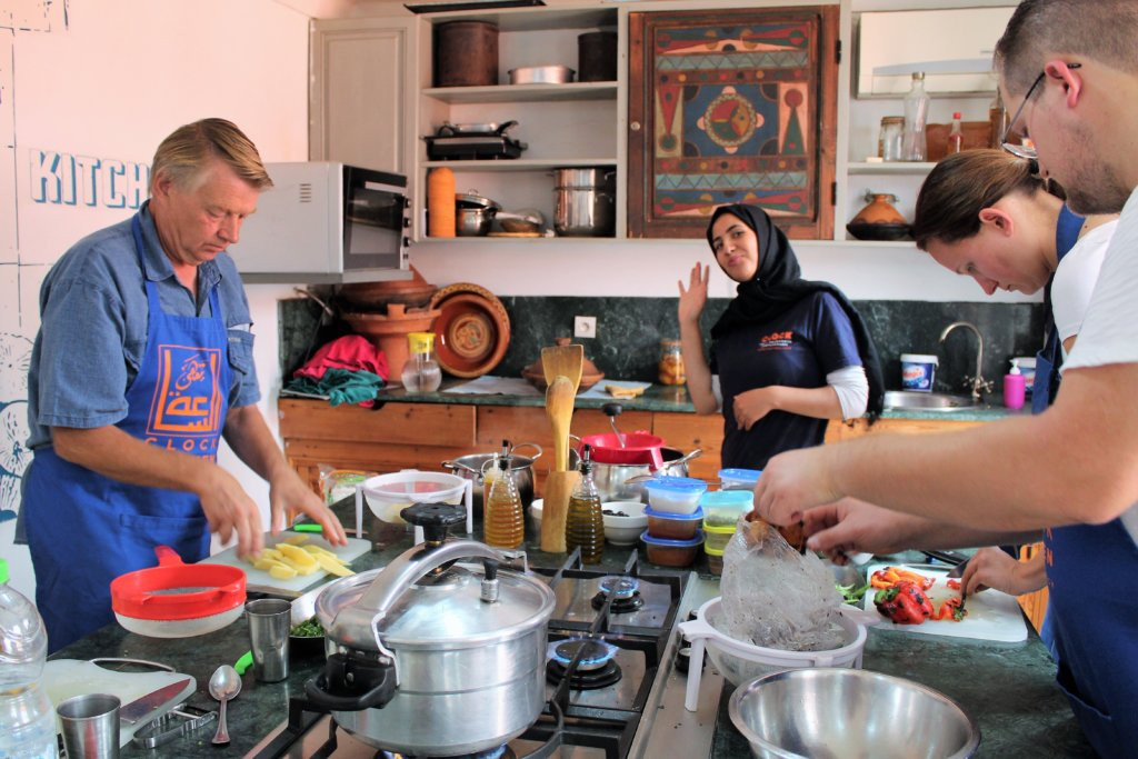 Person prepping vegetables during a cooking class in Marrakech