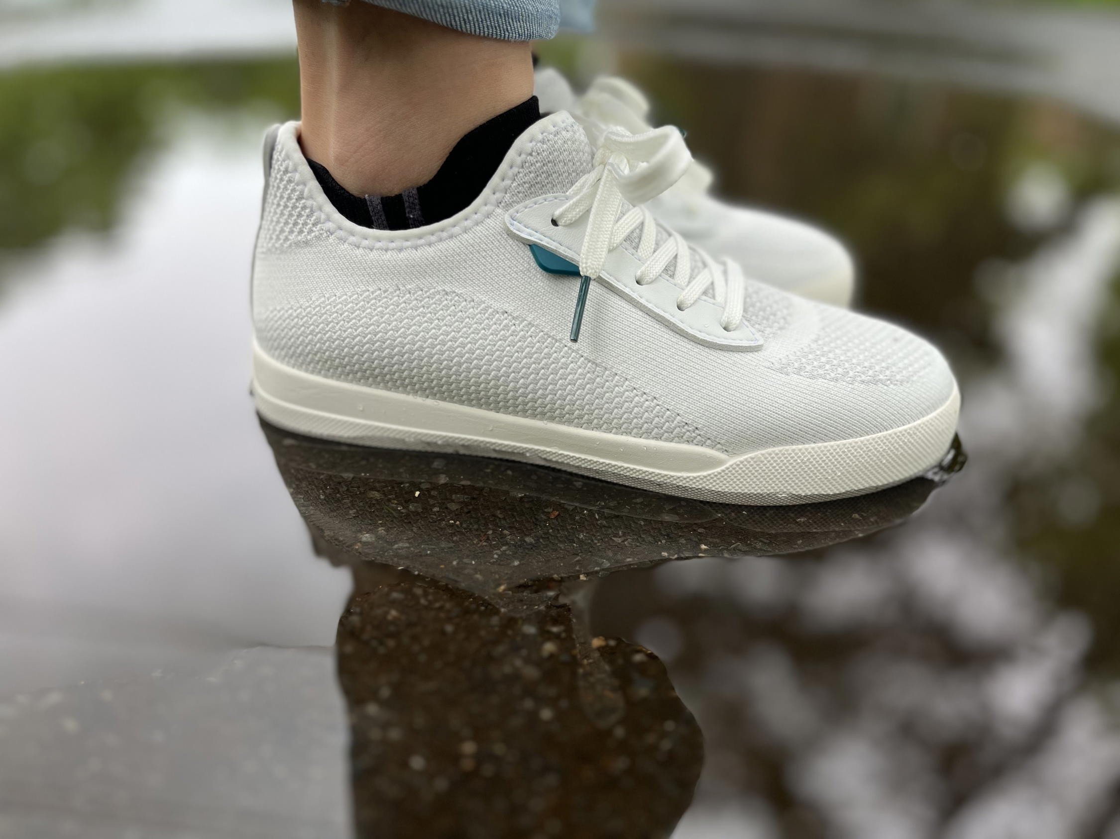 Another angle of water beading on Vessi Weekend Sneakers.