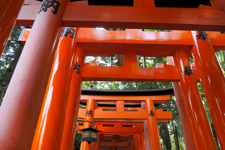 Fox statues at Fushimi Inari Shrine, Kyoto, considered messengers of the deity Inari.