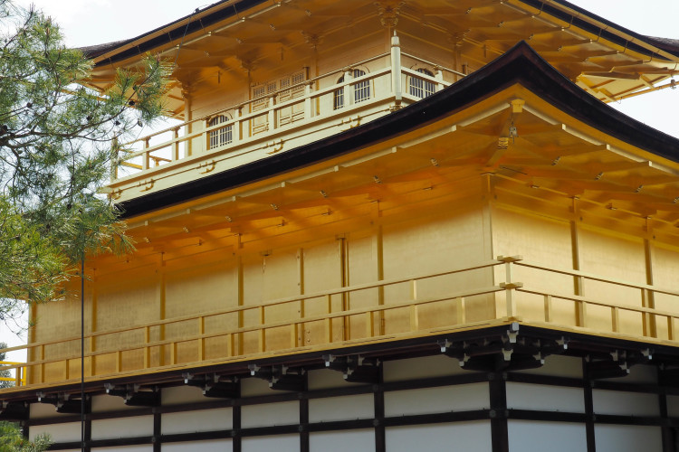 Close-up view of the Golden Pavilion (Kinkaku-ji) in Kyoto, showcasing its golden exterior.