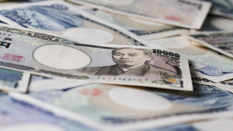 Japanese Yen banknotes, showcasing different denominations and portraits.