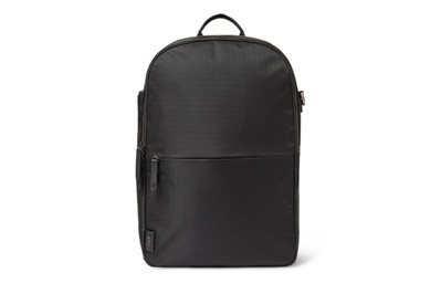 Close-up detail of the July Carry All Backpack 20L showcasing its leather zipper pulls and gunmetal hardware, emphasizing its upscale and chic design elements.