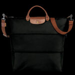 Black Longchamp Le Pliage Expandable Travel Bag made from recycled canvas