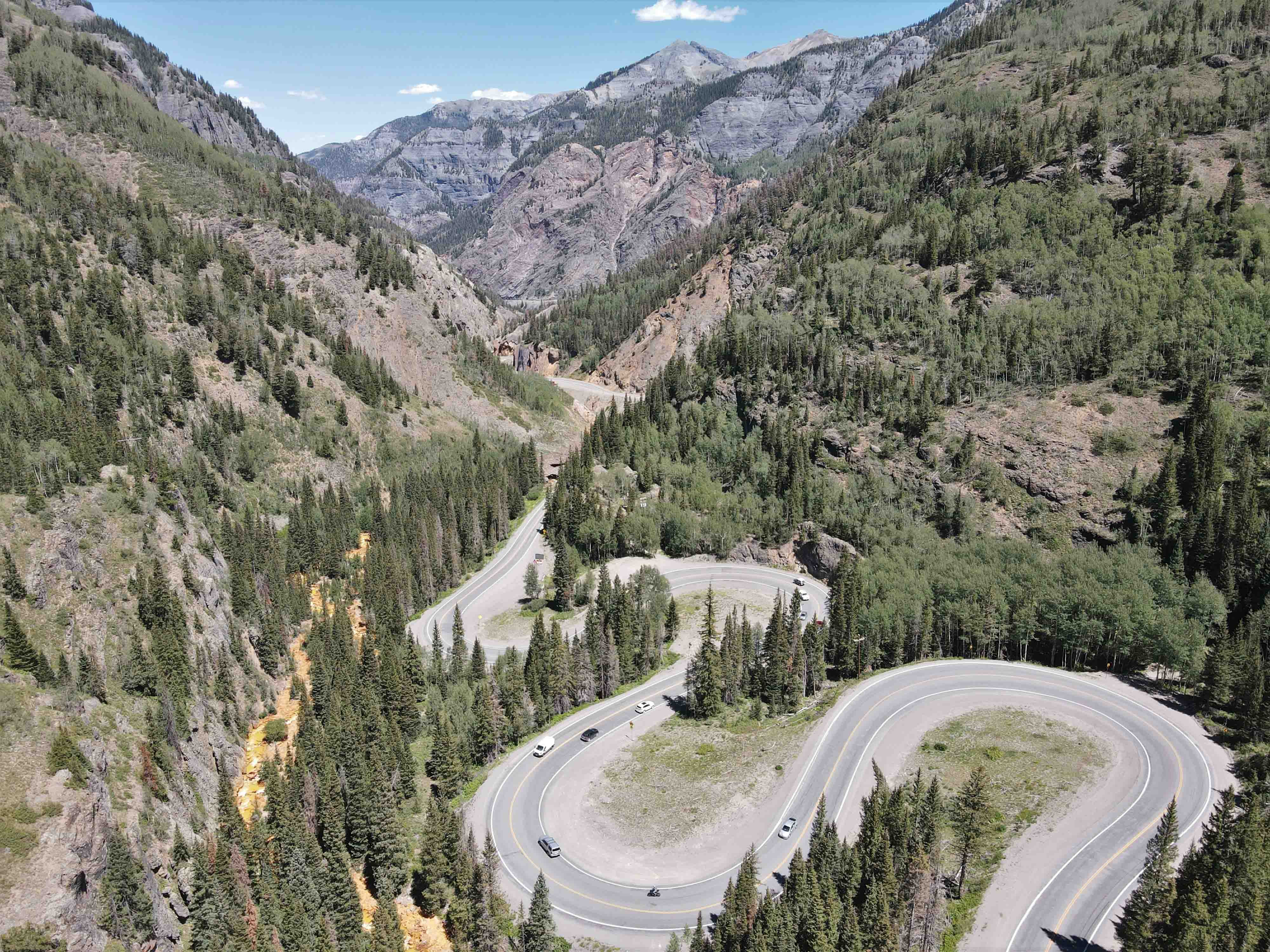 Twisty back road surrounded by mountains