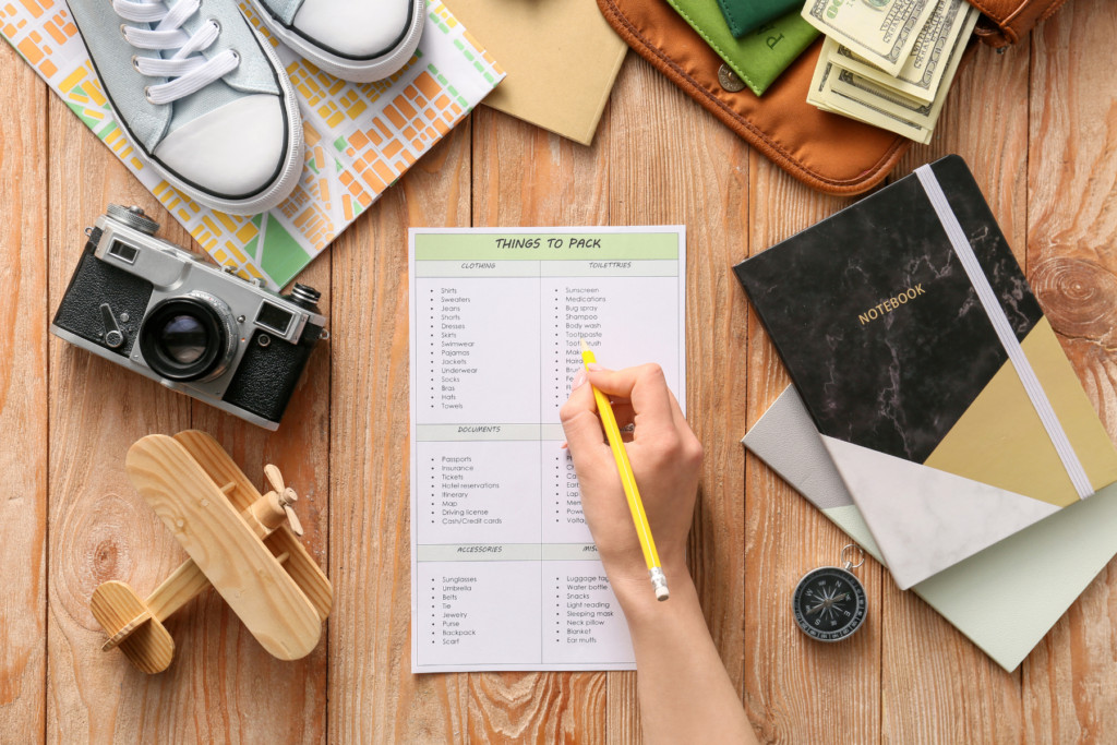 Person ticking items off a packing list