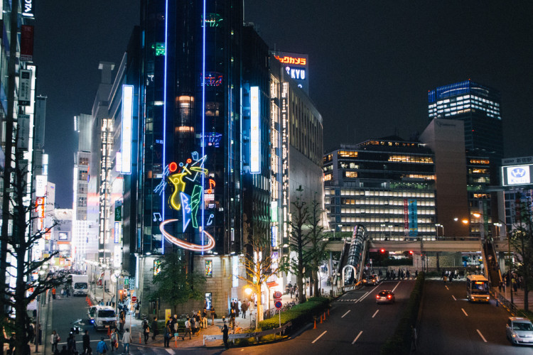 The Shinjuku skyline at night, showcasing skyscrapers and city lights.