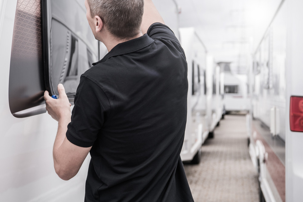Replacing an RV window with a helper