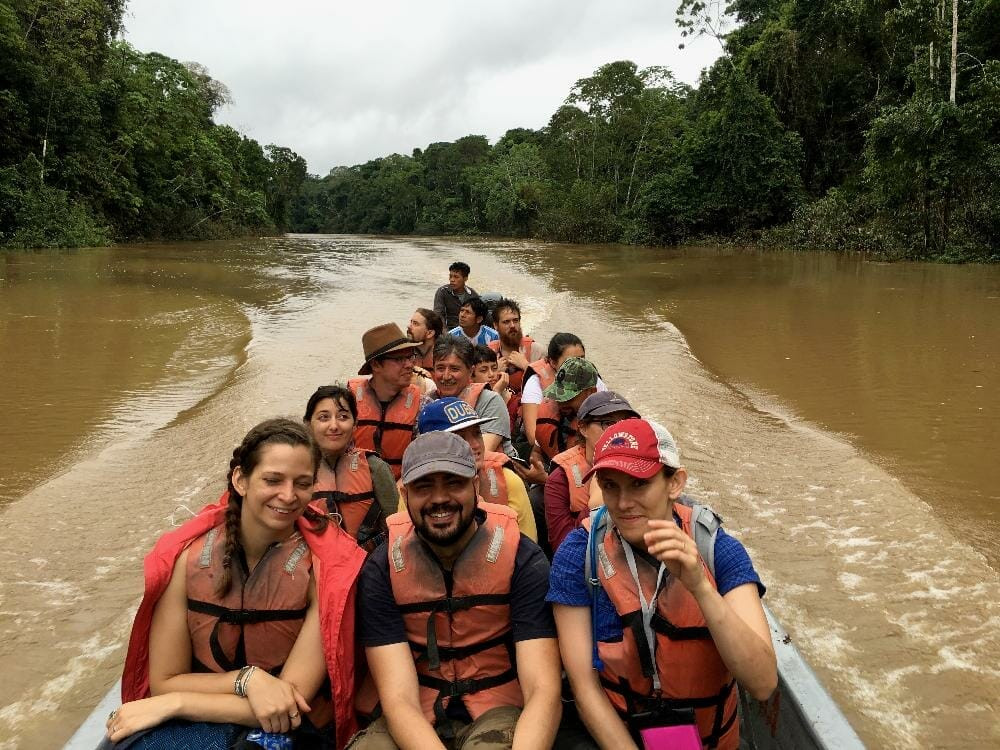 Students on a boat in the Amazon River, representing the indigenous sustainability solutions program.