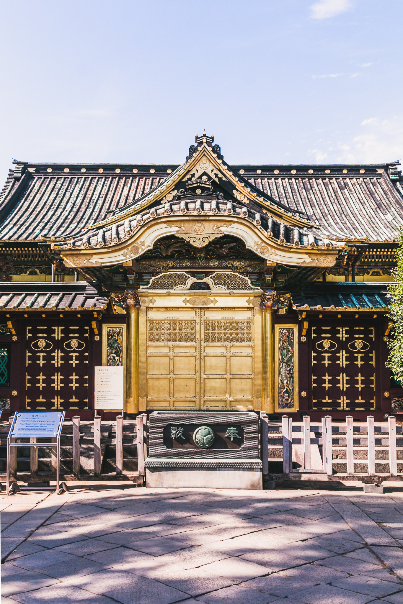 A traveler navigating a bustling Tokyo street using a smartphone, highlighting the importance of mobile connectivity and digital maps for exploring the city efficiently.