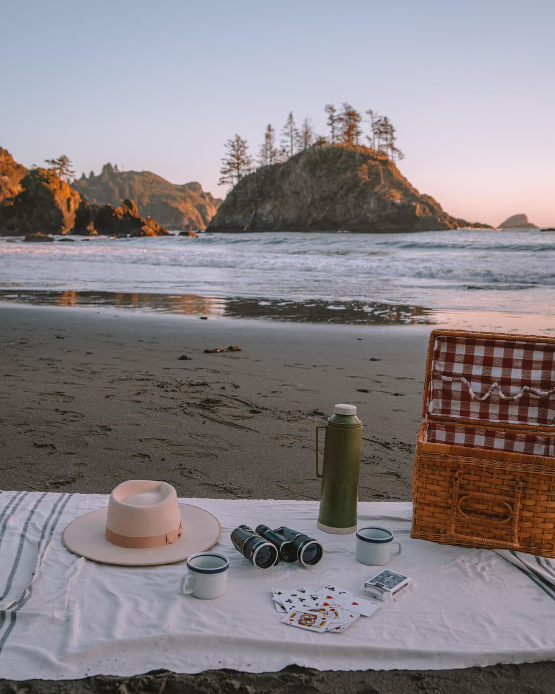 A picnic blanket laid out at College Cove in Trinidad, California, overlooking the stunning coastline