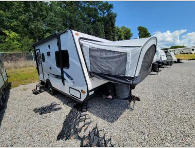 Exterior view of a used Jayco Jay Feather X17Z hybrid travel trailer, showcasing its compact size for easy towing.